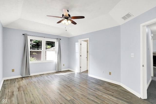 6059 Buck Blvd, Indianapolis, IN 46237 - empty room featuring a raised ceiling, ceiling fan, and wood finished floors