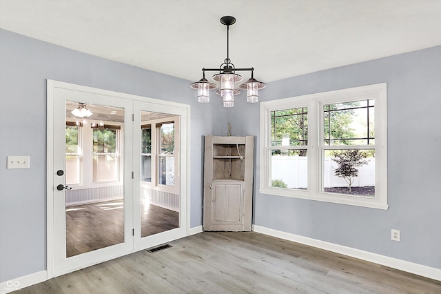 6059 Buck Blvd, Indianapolis, IN 46237 - unfurnished dining area featuring a chandelier and wood finished floors