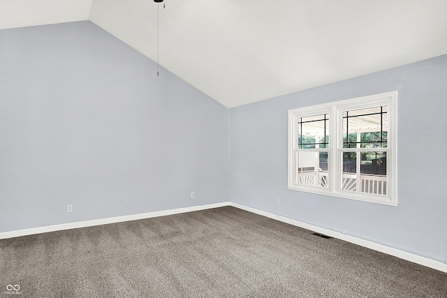 6059 Buck Blvd, Indianapolis, IN 46237 - spare room with lofted ceiling and dark carpet