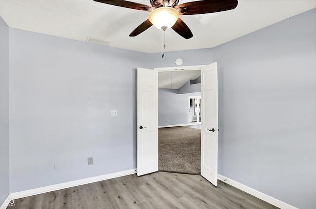 6059 Buck Blvd, Indianapolis, IN 46237 - empty room with light wood finished floors, ceiling fan, and a smoke detector