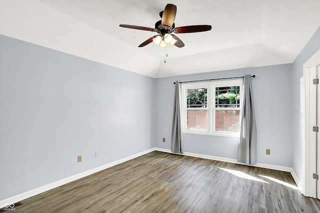 6059 Buck Blvd, Indianapolis, IN 46237 - spare room featuring wood finished floors, a ceiling fan, and lofted ceiling