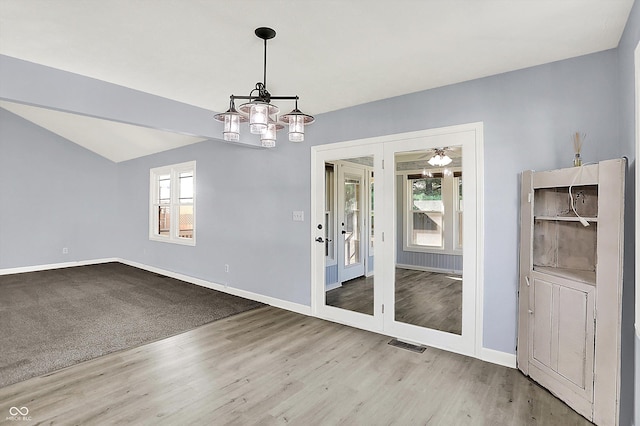 6059 Buck Blvd, Indianapolis, IN 46237 - empty room featuring a chandelier and wood finished floors