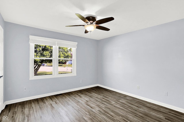 6059 Buck Blvd, Indianapolis, IN 46237 - empty room featuring dark wood-type flooring and a ceiling fan