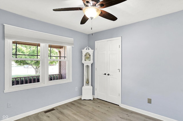 6059 Buck Blvd, Indianapolis, IN 46237 - unfurnished bedroom with light wood-style floors, a closet, and a ceiling fan