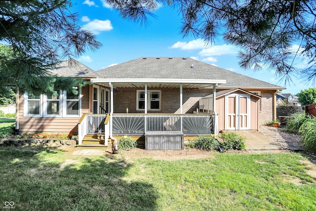 6059 Buck Blvd, Indianapolis, IN 46237 - back of property featuring a shed, brick siding, and a shingled roof