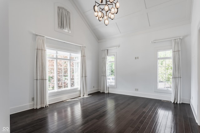 520 Willow Spring Rd, Indianapolis, IN 46240 - unfurnished room with healthy amount of natural light, dark wood-type flooring, vaulted ceiling, a chandelier, and attic access
