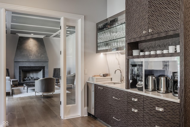520 Willow Spring Rd, Indianapolis, IN 46240 - indoor wet bar with dark wood-style flooring and a large fireplace