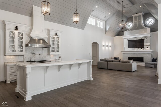 520 Willow Spring Rd, Indianapolis, IN 46240 - kitchen with high vaulted ceiling, wood ceiling, premium range hood, dark wood-style floors, and white cabinetry