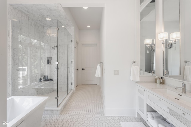 520 Willow Spring Rd, Indianapolis, IN 46240 - full bathroom with a freestanding tub, a chandelier, a stall shower, vanity, and recessed lighting