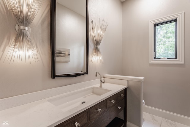 520 Willow Spring Rd, Indianapolis, IN 46240 - half bath featuring vanity and marble look tiles