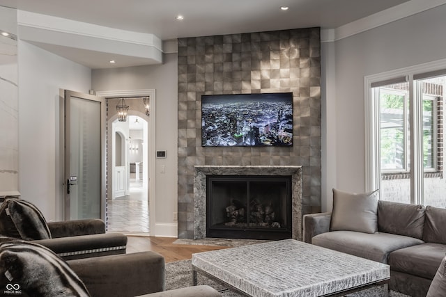 520 Willow Spring Rd, Indianapolis, IN 46240 - living area featuring a fireplace, arched walkways, recessed lighting, and wood finished floors