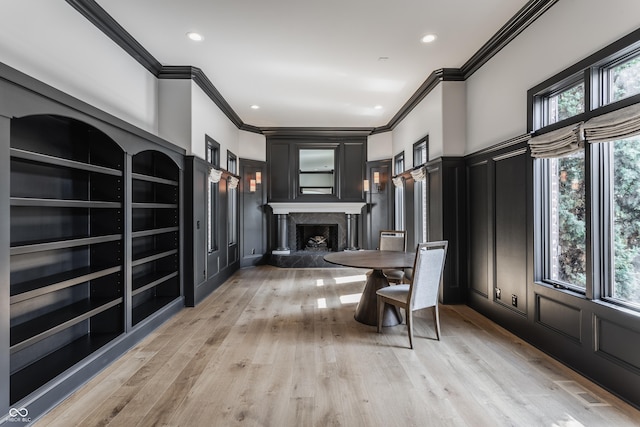 520 Willow Spring Rd, Indianapolis, IN 46240 - interior space featuring a decorative wall, crown molding, a high end fireplace, light wood-style floors, and recessed lighting