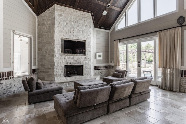520 Willow Spring Rd, Indianapolis, IN 46240 - living area with stone tile floors, high vaulted ceiling, wooden ceiling, a fireplace, and french doors