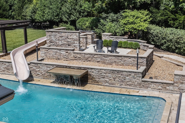 520 Willow Spring Rd, Indianapolis, IN 46240 - outdoor pool with a water slide and a patio area