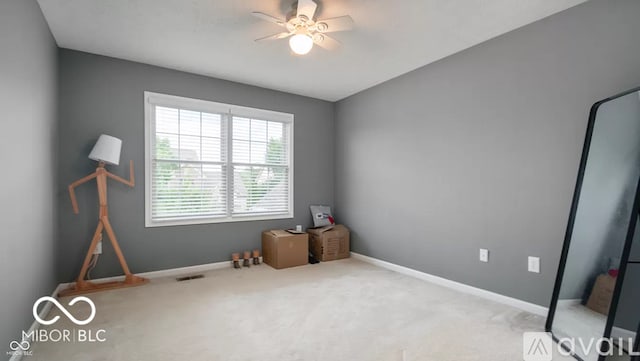12817 Mojave Dr, Fishers, IN 46037 - unfurnished bedroom with carpet flooring and a ceiling fan