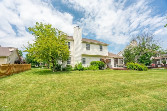 12817 Mojave Dr, Fishers, IN 46037 - back of property with a sunroom and a chimney