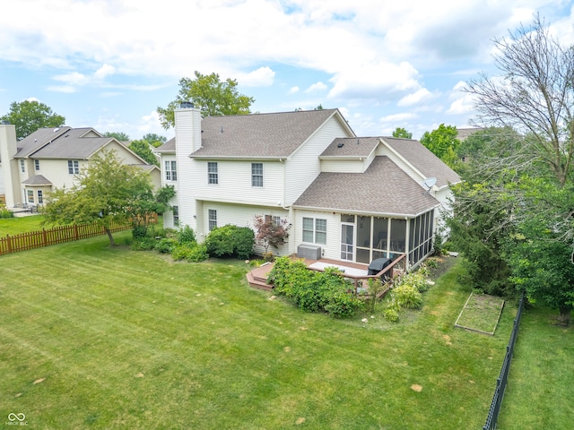 12817 Mojave Dr, Fishers, IN 46037 - back of property featuring a sunroom, roof with shingles, a chimney, and a deck