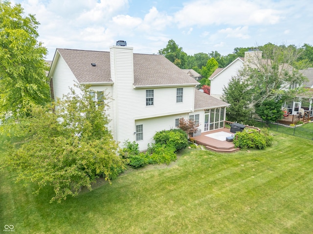 12817 Mojave Dr, Fishers, IN 46037 - back of house with a shingled roof, a wooden deck, and a chimney