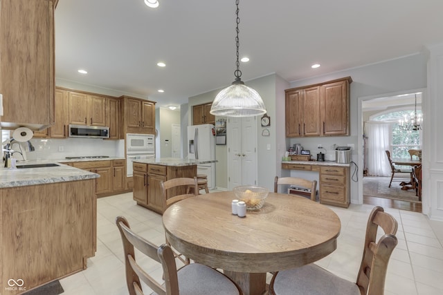 860 Old Eagle Way, Greenwood, IN 46143 - dining area featuring light tile patterned floors, recessed lighting, a chandelier, and ornamental molding