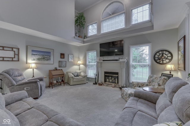 860 Old Eagle Way, Greenwood, IN 46143 - living area featuring a towering ceiling, carpet flooring, crown molding, and a glass covered fireplace