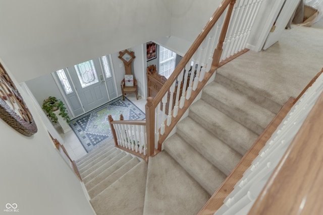 860 Old Eagle Way, Greenwood, IN 46143 - entryway with carpet floors and stairs