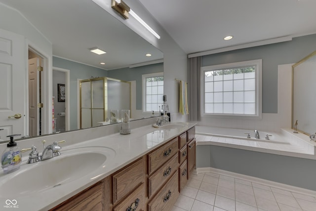 860 Old Eagle Way, Greenwood, IN 46143 - bathroom featuring double vanity, a stall shower, a garden tub, tile patterned floors, and recessed lighting