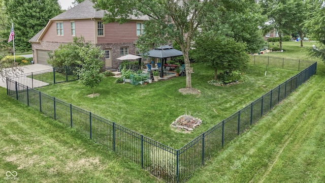 860 Old Eagle Way, Greenwood, IN 46143 - fenced yard with a gazebo, concrete driveway, and a garage