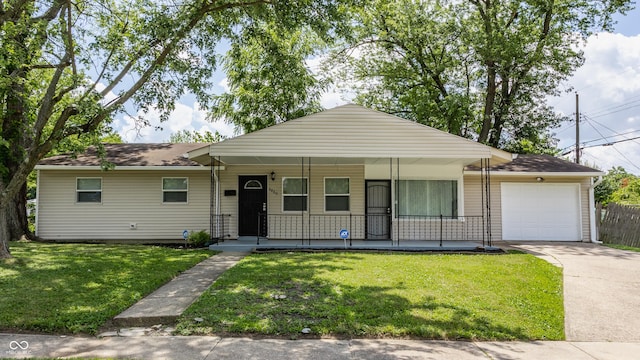 4880 N Katherine Dr, Indianapolis, IN 46226 - single story home featuring a porch, a garage, concrete driveway, and a front lawn