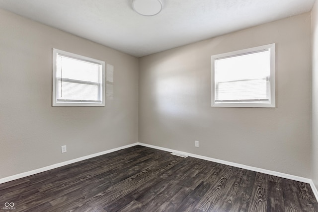 4880 N Katherine Dr, Indianapolis, IN 46226 - spare room with baseboards and dark wood-style floors