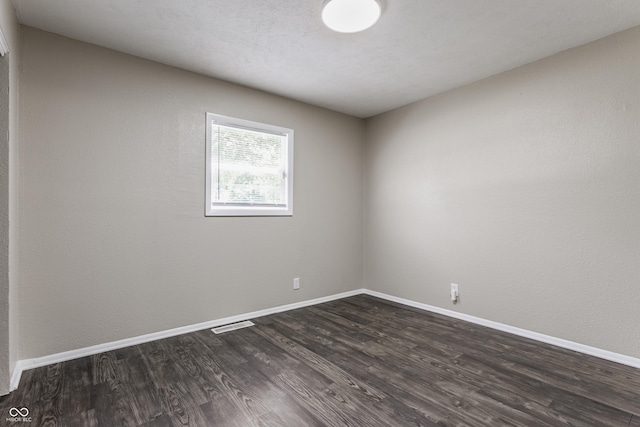 4880 N Katherine Dr, Indianapolis, IN 46226 - empty room with dark wood-style floors and baseboards