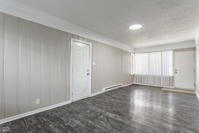 4880 N Katherine Dr, Indianapolis, IN 46226 - spare room with baseboard heating, dark wood-style floors, a textured ceiling, and ornamental molding
