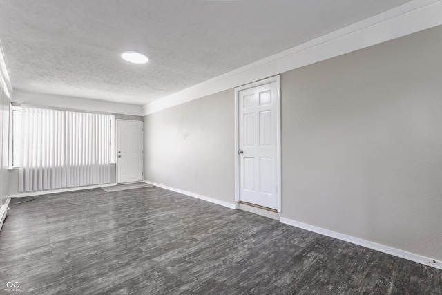 4880 N Katherine Dr, Indianapolis, IN 46226 - empty room featuring dark wood-type flooring and a textured ceiling