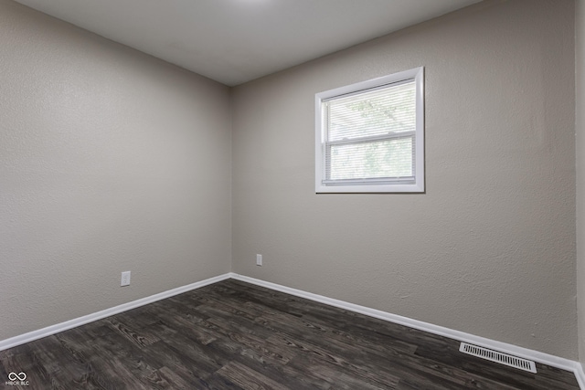 4880 N Katherine Dr, Indianapolis, IN 46226 - unfurnished room featuring dark wood-style floors and baseboards