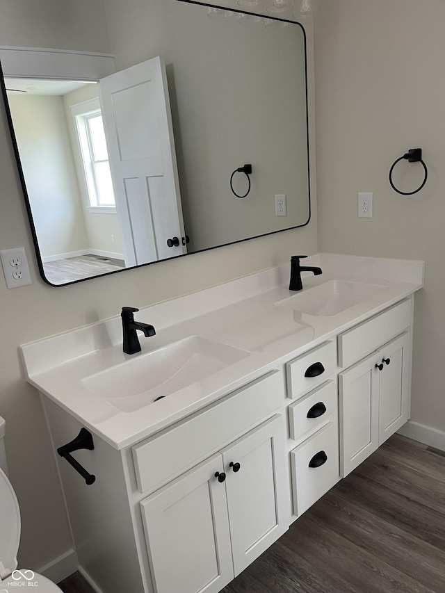 842 E Nutter St, Martinsville, IN 46151 - bathroom featuring double vanity and wood finished floors