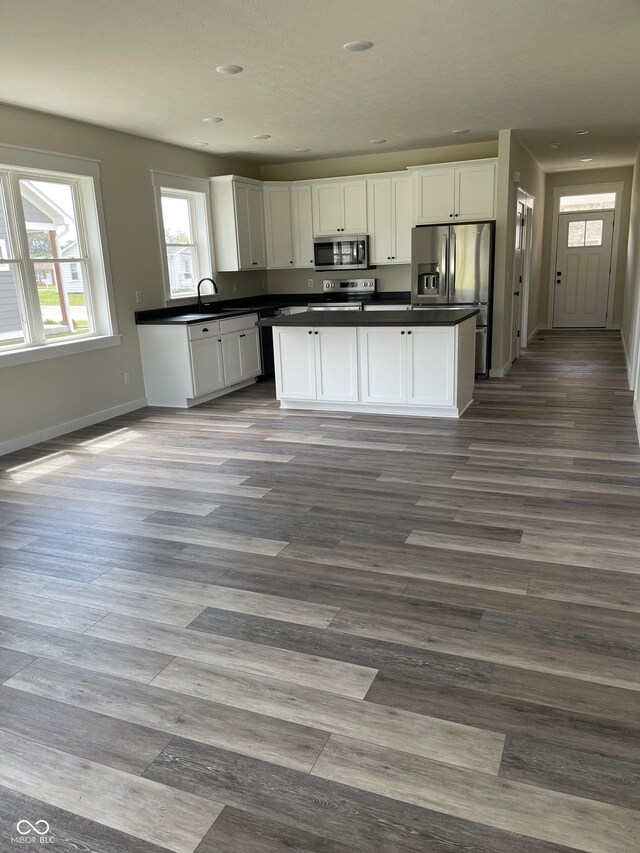 842 E Nutter St, Martinsville, IN 46151 - kitchen featuring stainless steel appliances, dark countertops, white cabinets, dark wood-style flooring, and recessed lighting