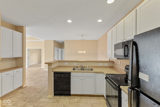 2815 Grandview Ln, Greenwood, IN 46143 - kitchen with black appliances, a peninsula, a chandelier, white cabinetry, and recessed lighting
