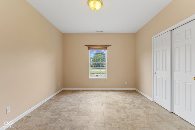 2815 Grandview Ln, Greenwood, IN 46143 - unfurnished bedroom with stone finish floors and a closet