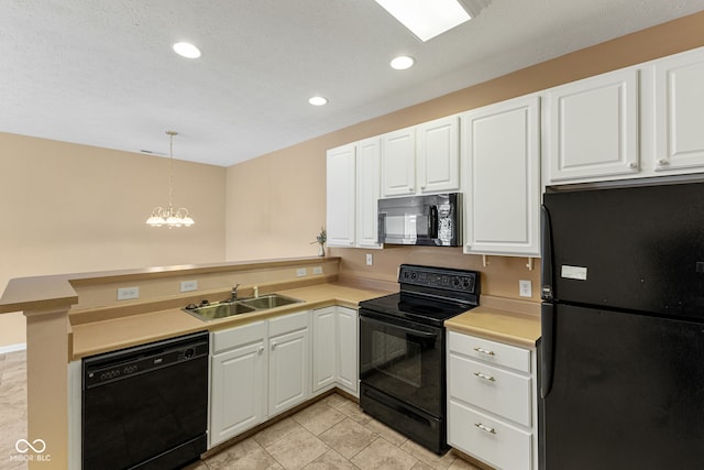 2815 Grandview Ln, Greenwood, IN 46143 - kitchen with black appliances, a peninsula, light countertops, white cabinetry, and recessed lighting