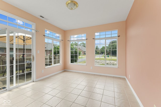 2815 Grandview Ln, Greenwood, IN 46143 - unfurnished sunroom with tile patterned flooring and baseboards