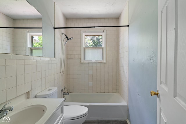3408 Harvest Ave, Indianapolis, IN 46226 - full bathroom featuring healthy amount of natural light, washtub / shower combination, and vanity
