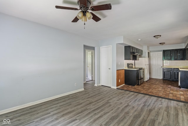 3408 Harvest Ave, Indianapolis, IN 46226 - kitchen featuring electric range oven, light countertops, dark wood-style flooring, a ceiling fan, and tasteful backsplash