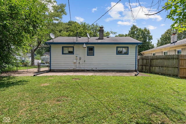 3408 Harvest Ave, Indianapolis, IN 46226 - rear view of property with a gate, a fenced backyard, a patio, and a chimney
