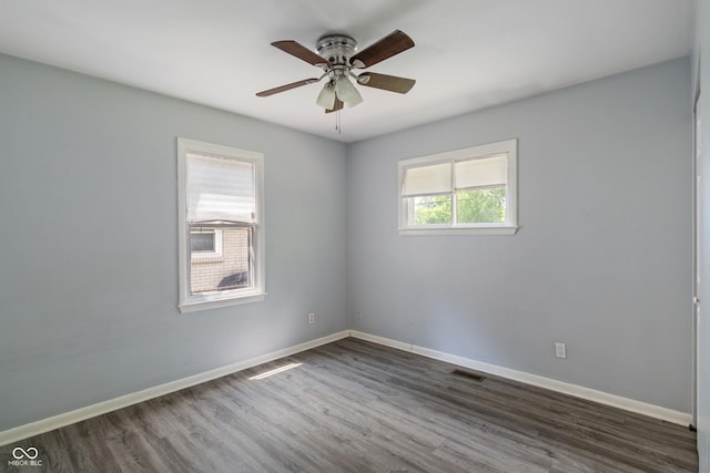 3408 Harvest Ave, Indianapolis, IN 46226 - spare room with dark wood-style floors and ceiling fan