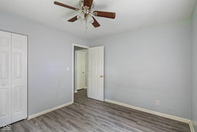 3408 Harvest Ave, Indianapolis, IN 46226 - unfurnished bedroom with a closet, wood finished floors, and a ceiling fan