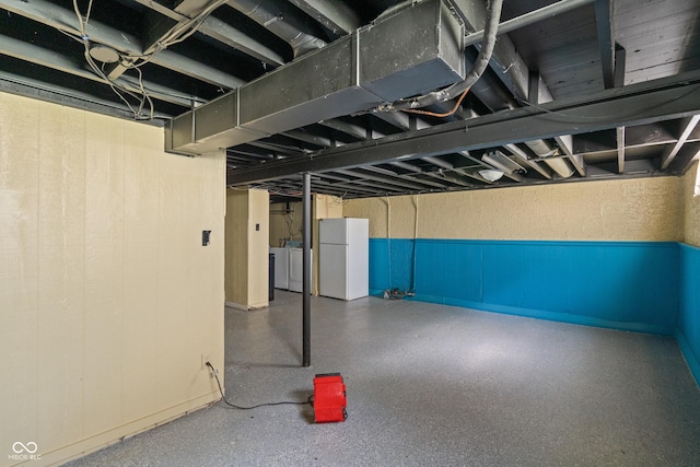 3408 Harvest Ave, Indianapolis, IN 46226 - unfinished below grade area with freestanding refrigerator and washing machine and clothes dryer