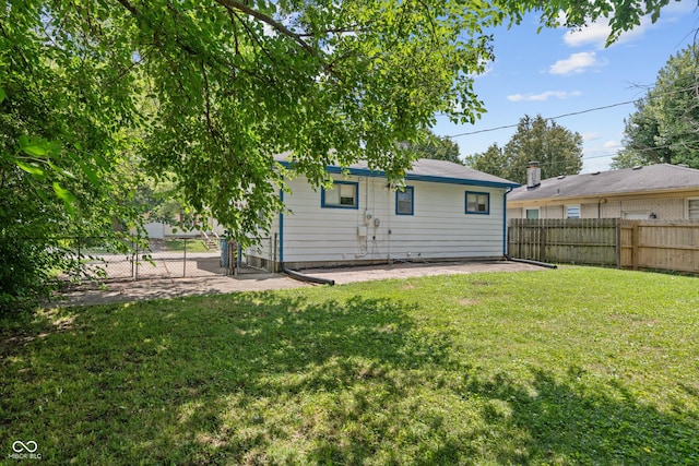 3408 Harvest Ave, Indianapolis, IN 46226 - rear view of house with a patio and a fenced backyard