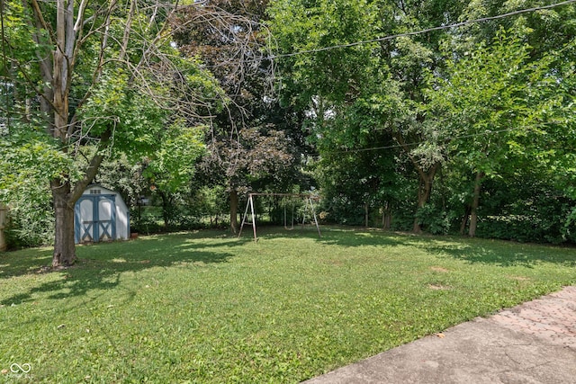 3408 Harvest Ave, Indianapolis, IN 46226 - view of grassy yard with a storage shed