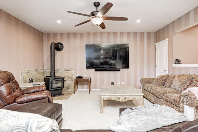 4297 W Division Rd, Crawfordsville, IN 47933 - living room with a wood stove, wallpapered walls, a ceiling fan, carpet flooring, and recessed lighting