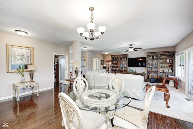 4297 W Division Rd, Crawfordsville, IN 47933 - dining area featuring a chandelier, ceiling fan, and dark wood-style flooring