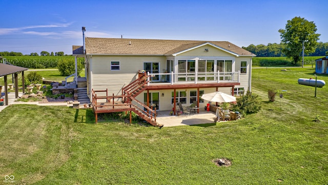 4297 W Division Rd, Crawfordsville, IN 47933 - back of property with stairs, a patio area, and a yard